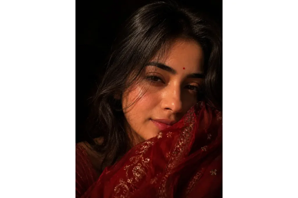 Realistic AI portrait of a woman in deep red embroidered fabric