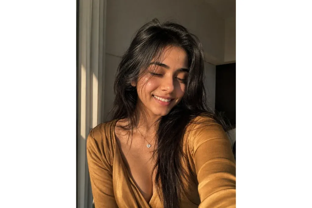 Smiling woman in a warm golden indoor portrait